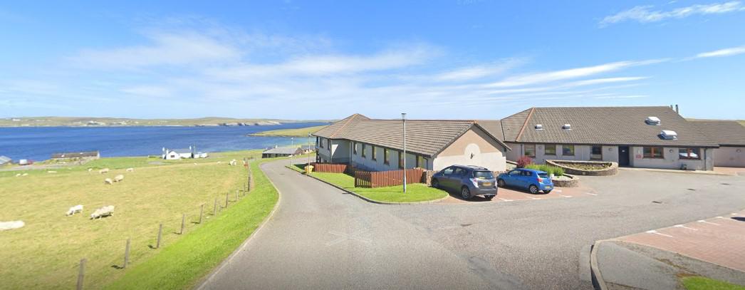 Overtonlea Care home looking out over sea and fields with sheep